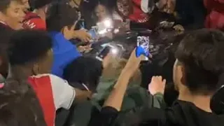 Aubameyang is mobbed by thrilled Arsenal fans while trying to leave D Emirates in his £240k Lamborg