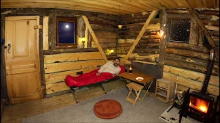 HIDING IN AN ABANDONED LOG CABIN FROM THE RAIN , NO ONE HAS LIVED HERE FOR 10 YEARS