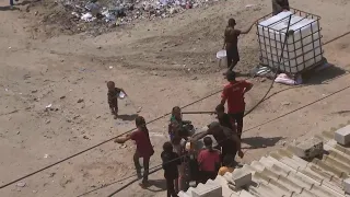 Food distributed at makeshift camp in Muwasi, Gaza