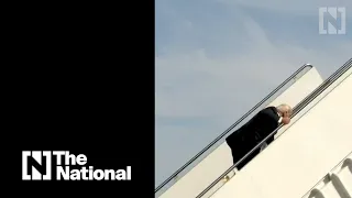 Joe Biden falls over as he boards Air Force One