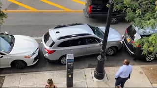 Skilled New York driver expertly maneuver his car out of a tight parking space!!!