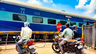 Train Accelerates Past Railroad Crossing In India