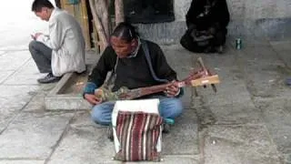 Tibetan street musician - Shigatse