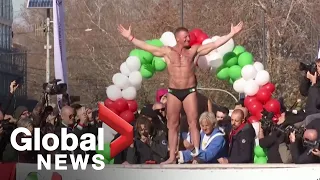 New Year's 2020: Italians dive into icy Tiber river during annual tradition in Rome