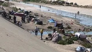 Hundreds of Mexican deportees end up living in Tijuana canal