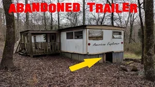 OLD ABANDONED TRAILER IN THE MOUNTAINS