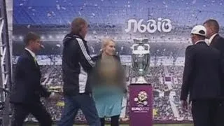 Topless woman tries to steal Euro 2012 cup