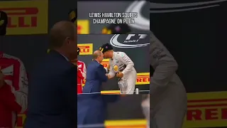 Lewis squirts champagne on putin!!