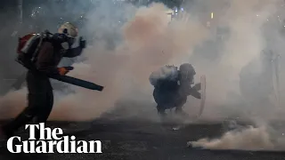 Portland protesters counter teargas with leaf blowers in standoff with federal troops