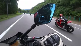 A female BMW S1000RR rider chases 2 Dudes on a Panigale