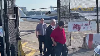 Bill Gates arrives in New York City after exiting a helicopter