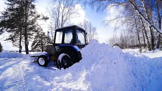 Гребем сугробы на мтз 82.1 двумя отвалами.