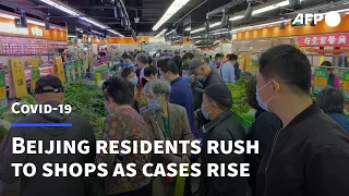 Beijing residents rush for groceries as Covid cases rise | AFP