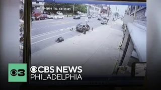 Surveillance video of shooting after car hitting motor scooter in Kensington, Philadelphia