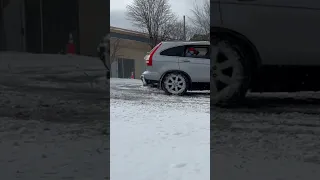 Honda CRV drifting in the snow.