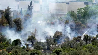 Firefighters extinguish fire near Israel Museum in Jerusalem | AFP