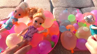 Water balloons! Elsa & Anna toddlers - pool - water fun - floaties