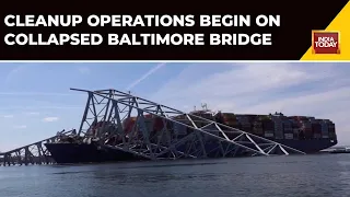 View Of Cargo Ship & Collapsed Baltimore Bridge From Coast Guard Boat As Recovery Effort Continues