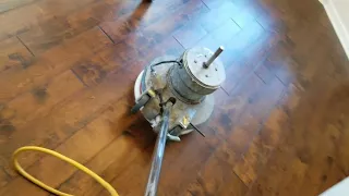 Using a white pad to buff out hardwood floors