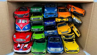 Box full of Various Model Cars Supra, Tesla, Lexus, Bugatti, Lamborghini, Ferrari, Jeep, Mclaren VW