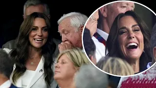 Delighted Kate Middleton is cheered by 60,000 crowd as she watch England in the Rugby World Cup