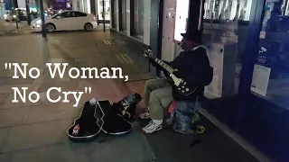 Busker in London sings "No Woman, No Cry" by Bob Marley