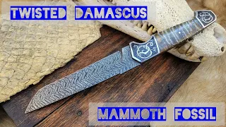 I made a twisted damascus knife with mammoth fossil