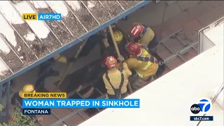 Woman rescued after falling down 25-foot sinkhole in Fontana