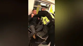 British policeman fights man refusing to wear a mask on a train