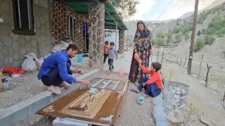 rural life . Babak paints the doors and windows of the kitchen and bathroom