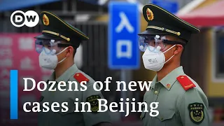 Beijing on partial lockdown after new coronavirus cluster emerges | DW News