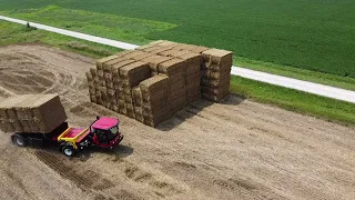 MIL-STAK SP/3255 stacking bales of straw.