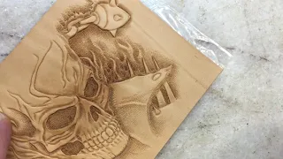The process of stamping the ghost rider. Embossed skull on vegetable-tanned leather.