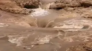 Hole in Saudi desert swallows huge amounts of rain water -  Hafar Al-Batin