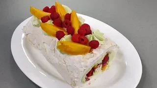 Meringue roulade with berries and pistachio cream