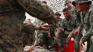 Watch U.S. Navy & Philippine Corpsmen Collaborate To Save Lives!