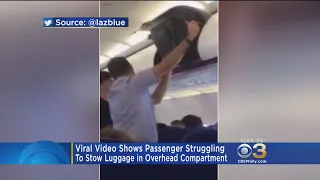 Video Of Struggling Passenger Putting Luggage In Overhead Compartment Incorrectly Goes Viral