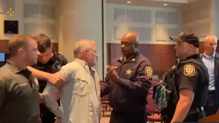 Chaos erupts at Virginia school board meeting with two parents arrested