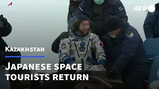 Japanese space tourists return to Earth after 12 days on ISS | AFP