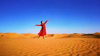 Dance in Taklimakan desert in Xinjiang