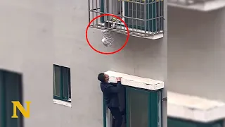 Heroes climbs out the window to save a toddler dangling from 4th-floor