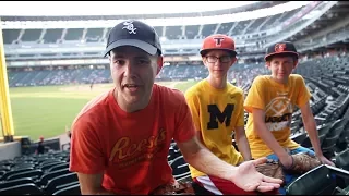 Helping two kids catch baseballs at Guaranteed Rate Field