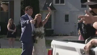 Couple invites friends to drive-by wedding reception