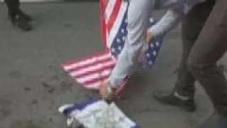 US flags burnt at Iran demo as Biden tours Mideast