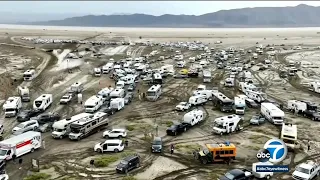 Burning Man festival a muddy mess as heavy rain strands thousands