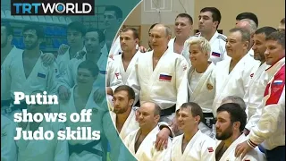 Putin demonstrates black belt judo skills