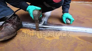 stock footage male worker test steel tank butt weld carbon bottom plate of storage tank oil backgrou
