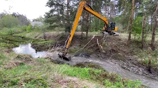 Beaver dam removal with excavator.