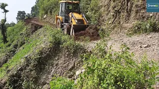 Very Narrow Hilly Road Backhoe Loader Clearing and Leveling Road