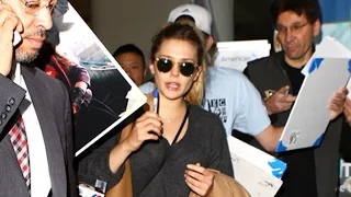 Elizabeth Olsen Surrounded For Autographs At LAX